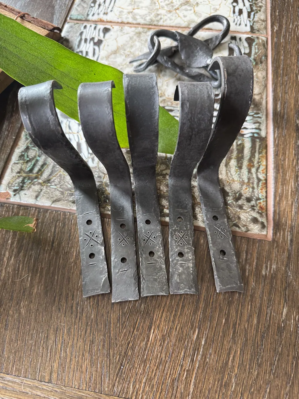 A set of brackets for hanging plants.